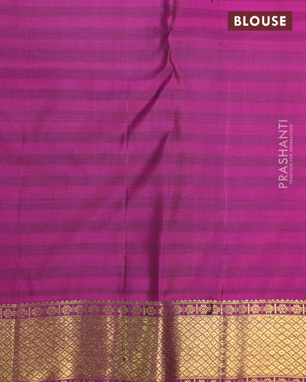 Pure kanjivaram silk saree dual shade of dark green and magenta pink with zari woven paisley buttas and zari woven border & butta style