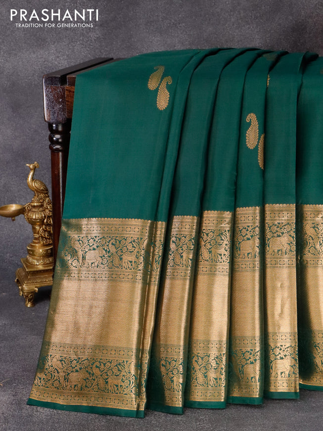 Pure kanjivaram silk saree dark green with zari woven paisley buttas and long zari woven border & butta style