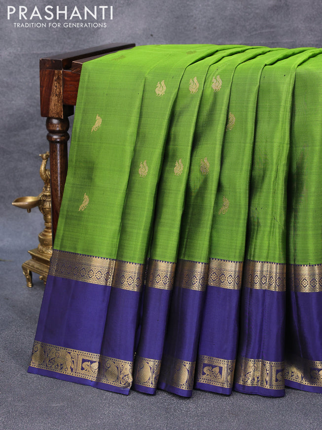 Pure kanjivaram silk saree green and navy blue with annam & peacock zari woven buttas and rettapet zari woven border & butta style