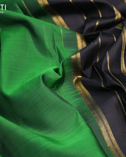 Pure kanjivaram silk saree green and black with zari woven buttas and zari woven border & butta style