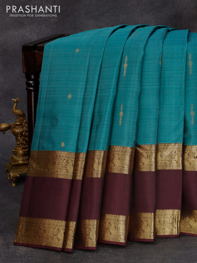 Pure kanjivaram silk saree pastel blue shade and wine shade with allover zari woven floral buttas and annam rettapet zari woven border & butta style