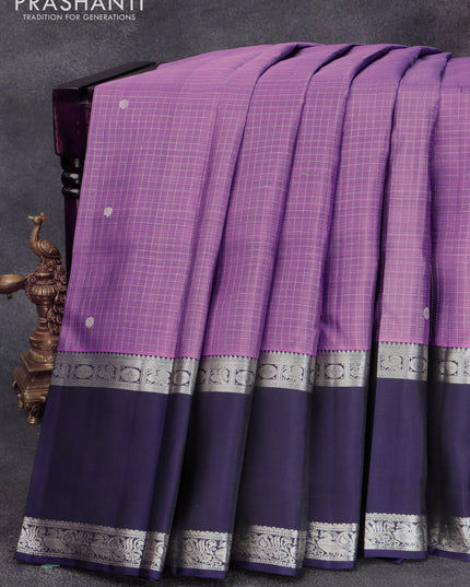 Pure kanjivaram silk saree purple shade and navy blue with allover silver checks pattern & buttas and rettapet silver zari woven border & checks