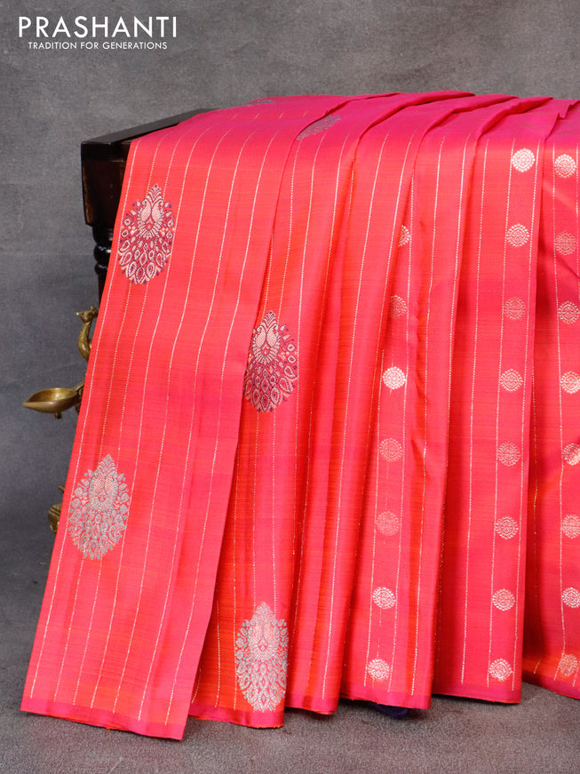 Pure kanjivaram silk saree dual shade of pinkish orange and navy blue with allover zari weaves & buttas in borderless style & borderless style