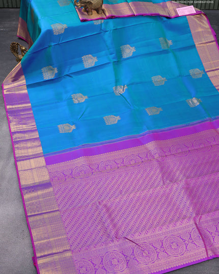 Pure kanjivaram silk saree dual shade of bluish green and purple with zari woven buttas and zari woven border & butta style