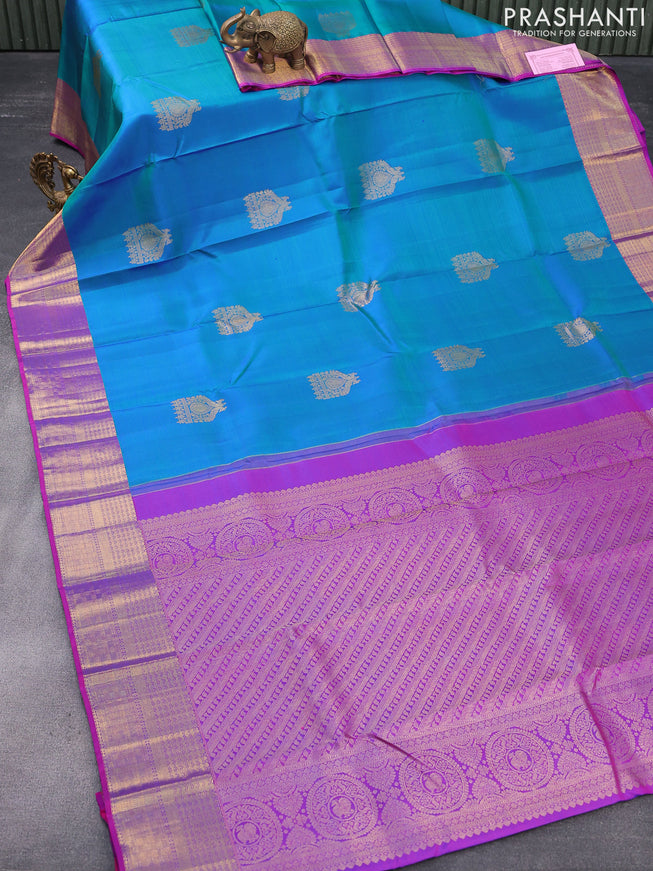 Pure kanjivaram silk saree dual shade of bluish green and purple with zari woven buttas and zari woven border & butta style