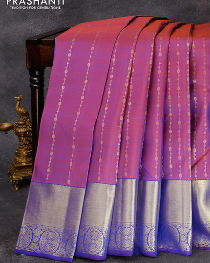 Pure kanjivaram silk saree dual shade of bluish rust and blue with allover zari weaves and zari woven border & allover weaves