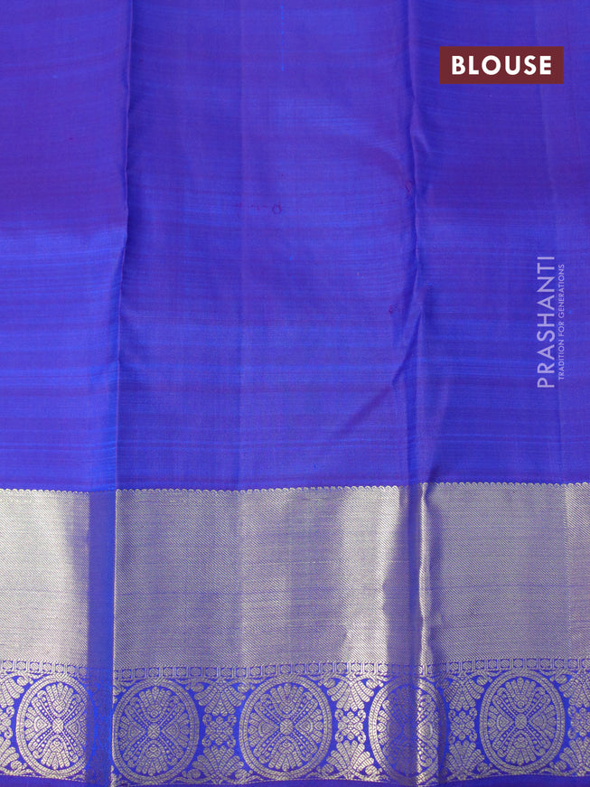 Pure kanjivaram silk saree dual shade of bluish rust and blue with allover zari weaves and zari woven border & allover weaves