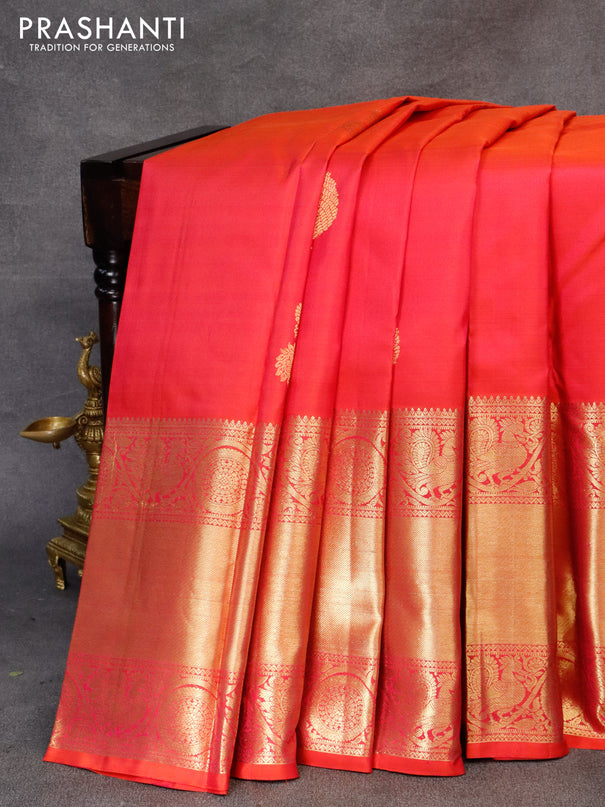 Pure kanjivaram silk saree dual shade of pinkish orange with zari woven buttas and long annam zari woven border & butta style