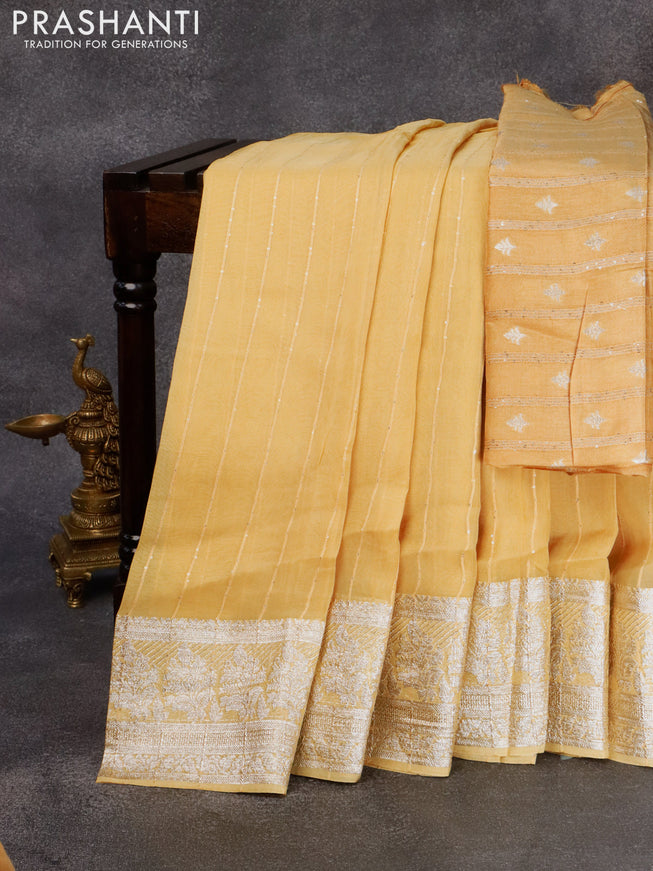 Chinon silk saree yellow shade with allover sequin work and zari woven floral border & zari butta blouse