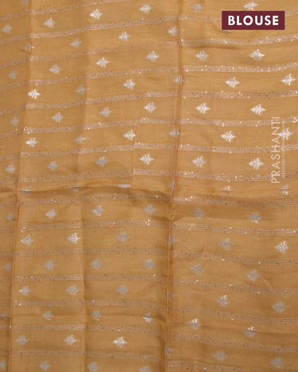 Chinon silk saree pale yellow shade with allover sequin work and zari woven floral border & zari butta blouse