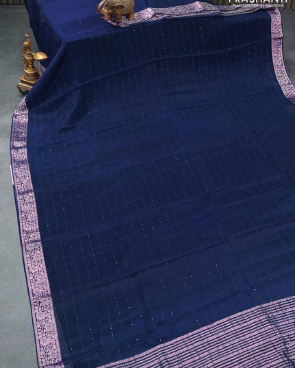 Chinon silk saree peacock blue with allover sequin work and zari woven floral border & zari butta blouse