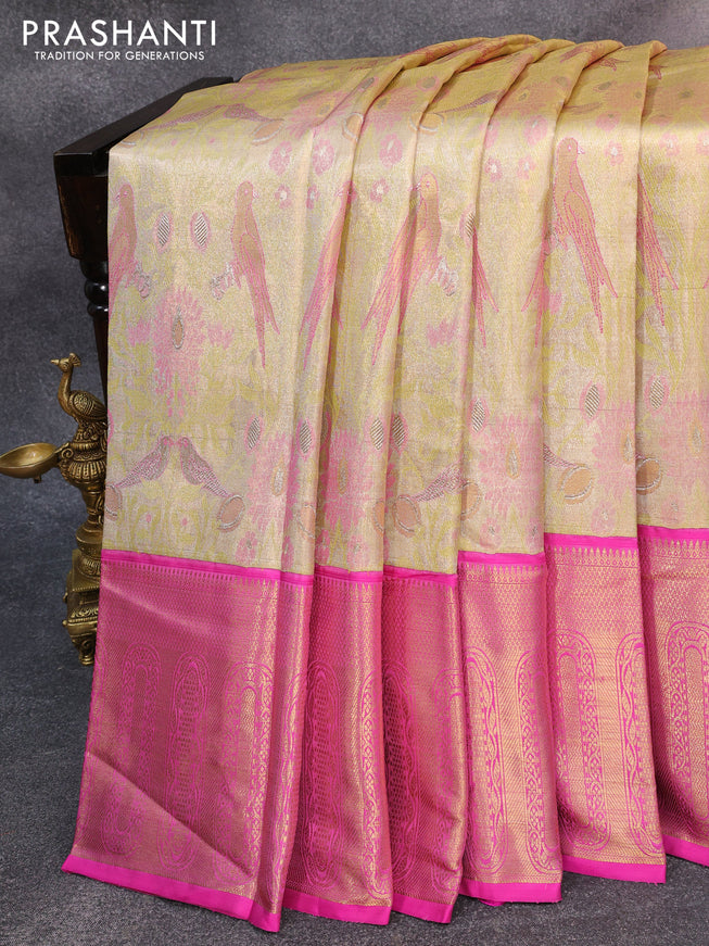 Pure kanjivaram tissue silk saree elaichi green and pink with allover zari woven parrot designbrocade weaves and long zari woven korvai border