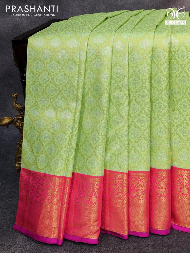 Pure kanjivaram silk saree pista green and dual shade of pinkish orange with allover silver & gold zari woven brocade weaves and floral zari woven korvai border