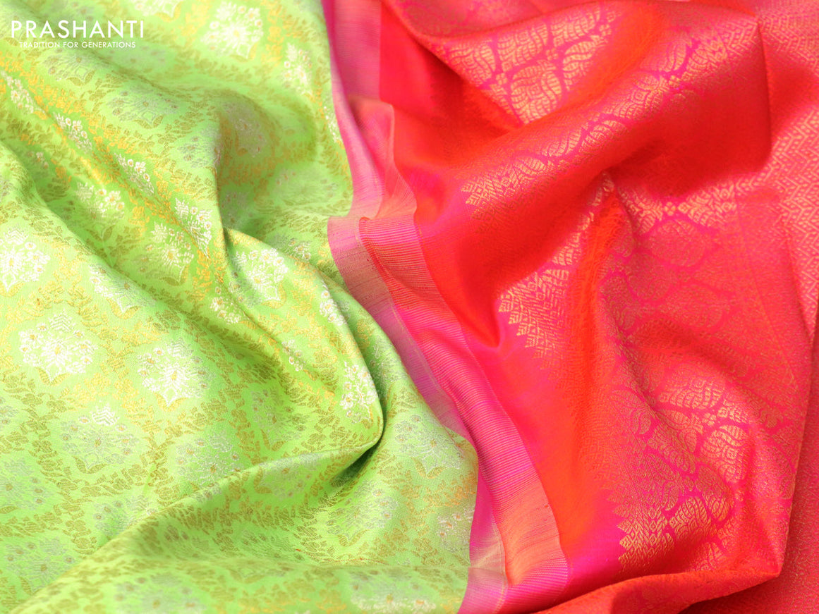 Pure kanjivaram silk saree pista green and dual shade of pinkish orange with allover silver & gold zari woven brocade weaves and floral zari woven korvai border
