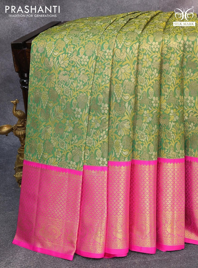 Pure kanjivaram silk saree green and pink with allover zari woven brocade weaves and long zari woven annam border
