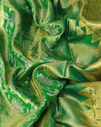 Pure kanjivaram tissue silk saree light green and green with allover silver zari woven floral brocade weaves and long rich zari woven floral border