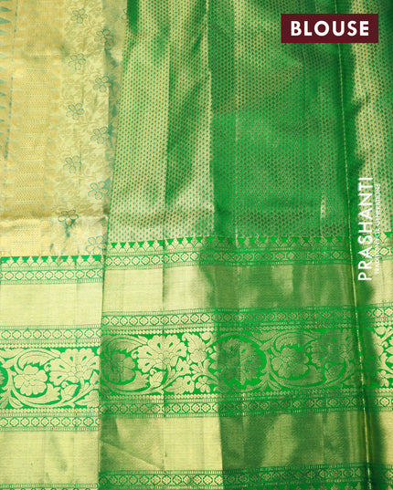 Pure kanjivaram tissue silk saree light green and green with allover silver zari woven floral brocade weaves and long rich zari woven floral border