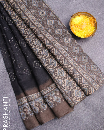 Semi linen saree black and grey shade with allover bandhani prints and ajrakh printed pallu