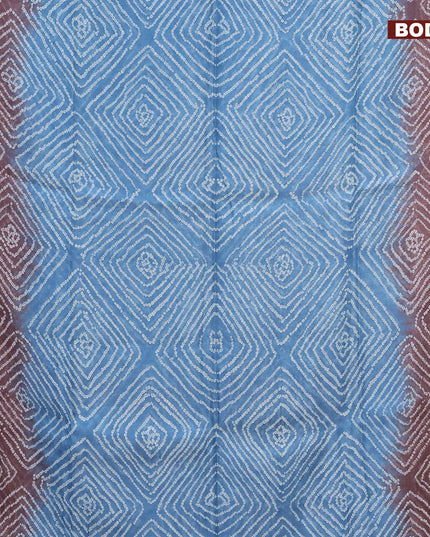 Semi linen saree light blue shade and brown with allover bandhani prints and batik printed border