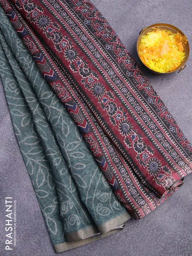 Semi linen saree green shade and black with allover bandhani prints and ajrakh printed pallu