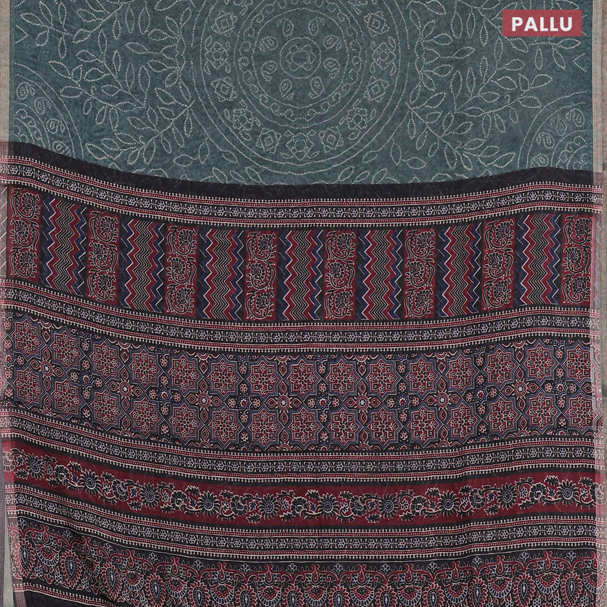 Semi linen saree green shade and black with allover bandhani prints and ajrakh printed pallu