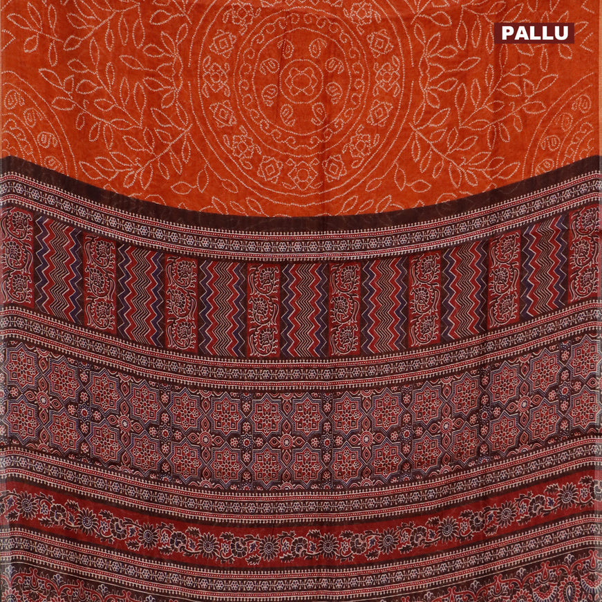 Semi linen saree rustic orange and black with allover bandhani prints and ajrakh printed pallu