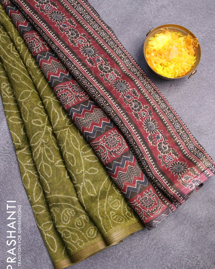 Semi linen saree light green and black with allover bandhani prints and ajrakh printed pallu