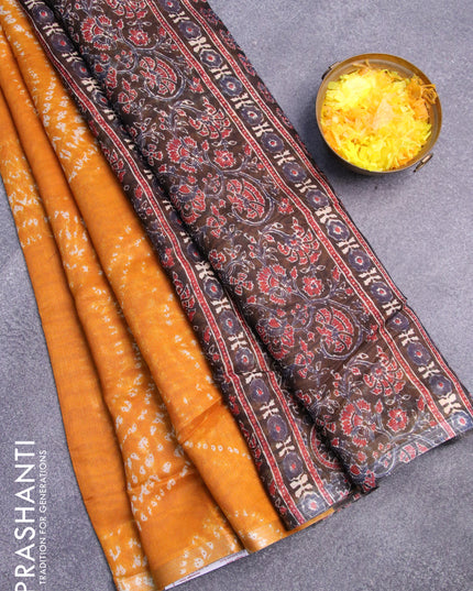 Semi linen saree mustard yellow and black with allover shibori prints and ajrakh printed pallu