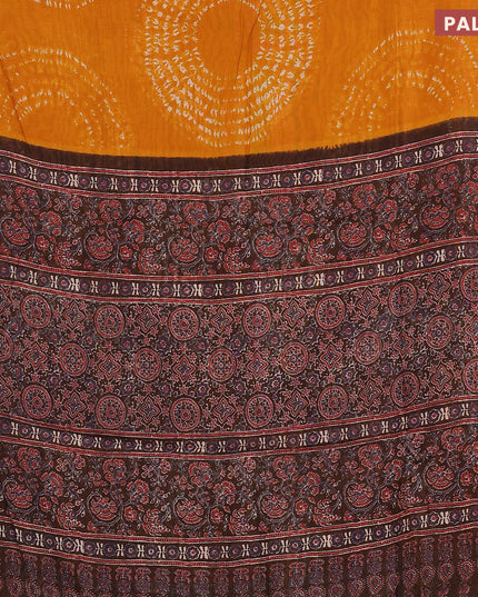 Semi linen saree mustard yellow and black with allover shibori prints and ajrakh printed pallu