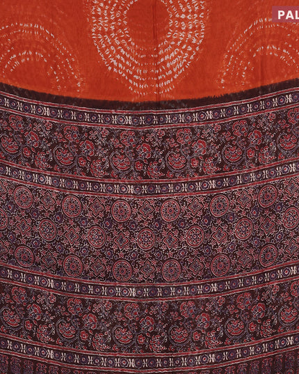 Semi linen saree rustic orange and black with allover shibori prints and ajrakh printed pallu