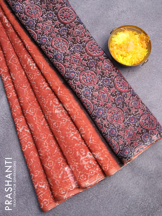 Semi linen saree rustic orange and black with allover patola prints and ajrakh printed pallu