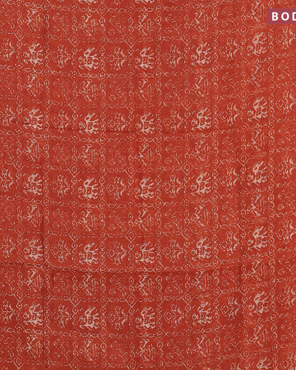 Semi linen saree rustic orange and black with allover patola prints and ajrakh printed pallu