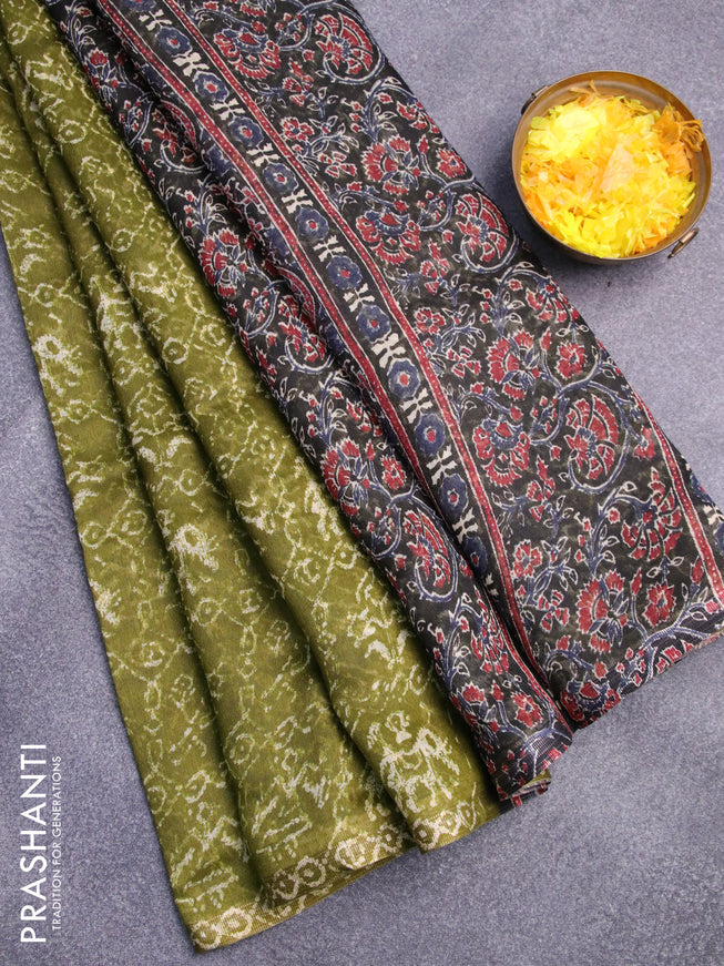 Semi linen saree light green and black with allover patola prints and ajrakh printed pallu