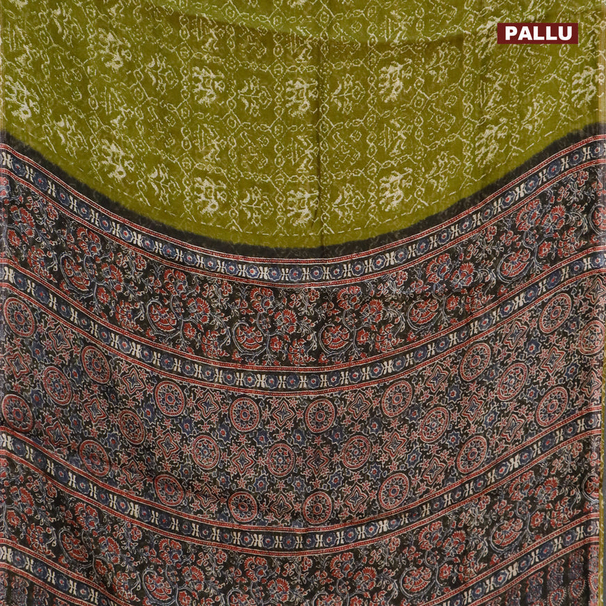 Semi linen saree light green and black with allover patola prints and ajrakh printed pallu
