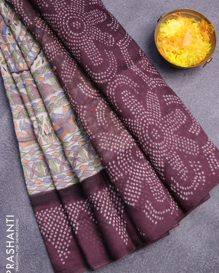 Semi linen saree cream and deep wine shade with allover madhubani prints and bandhani printed pallu