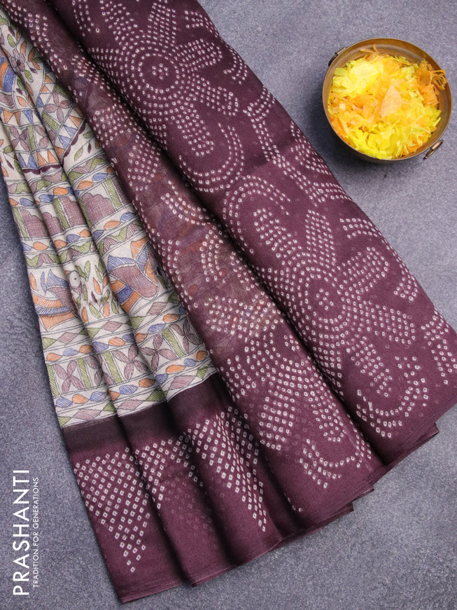 Semi linen saree cream and deep wine shade with allover madhubani prints and bandhani printed pallu
