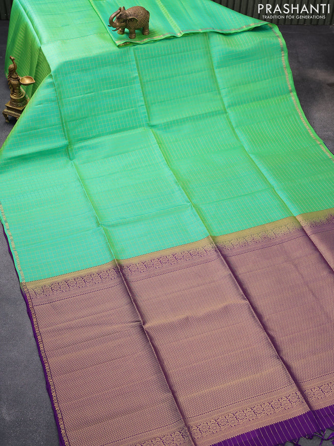 Pure soft silk saree dual shade of teal green and violet with allover zari checked pattern and small zari woven border