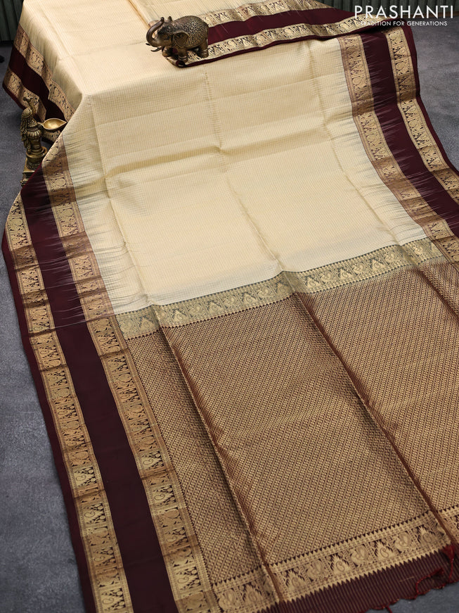 Pure soft silk saree sandal and deep maroon with allover small zari checked pattern and rettapet zari woven border