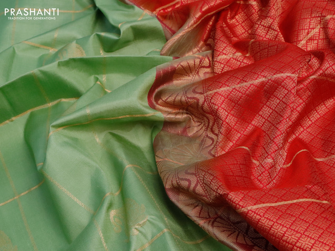 Pure soft silk saree pastel green and pink with allover zari checks & buttas and rettapet zari woven border