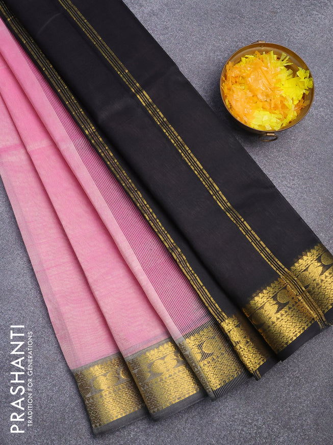 Silk cotton saree light pink and black with plain body and zari woven border