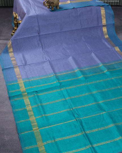 Silk cotton saree grey and green with plain body and zari woven simple border