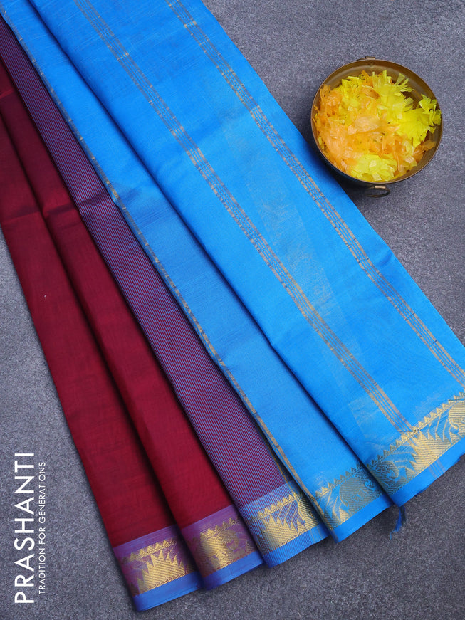 Silk cotton saree dark magenta pink and light blue with plain body and small zari woven border