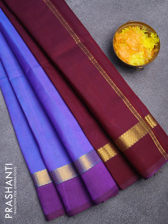 Silk cotton saree dual shade of blue and deep maroon with plain body and zari woven simple border