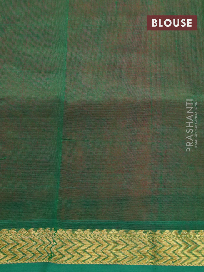 Silk cotton saree dual shade of pinkish orange and green with plain body and small zari woven border