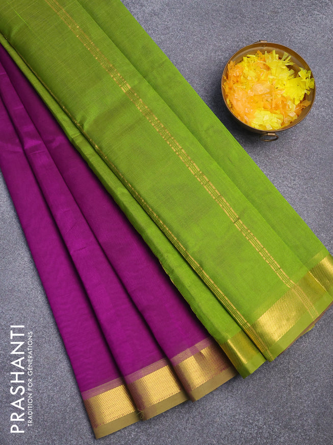 Silk cotton saree deep purple and light green with plain body and small zari woven border