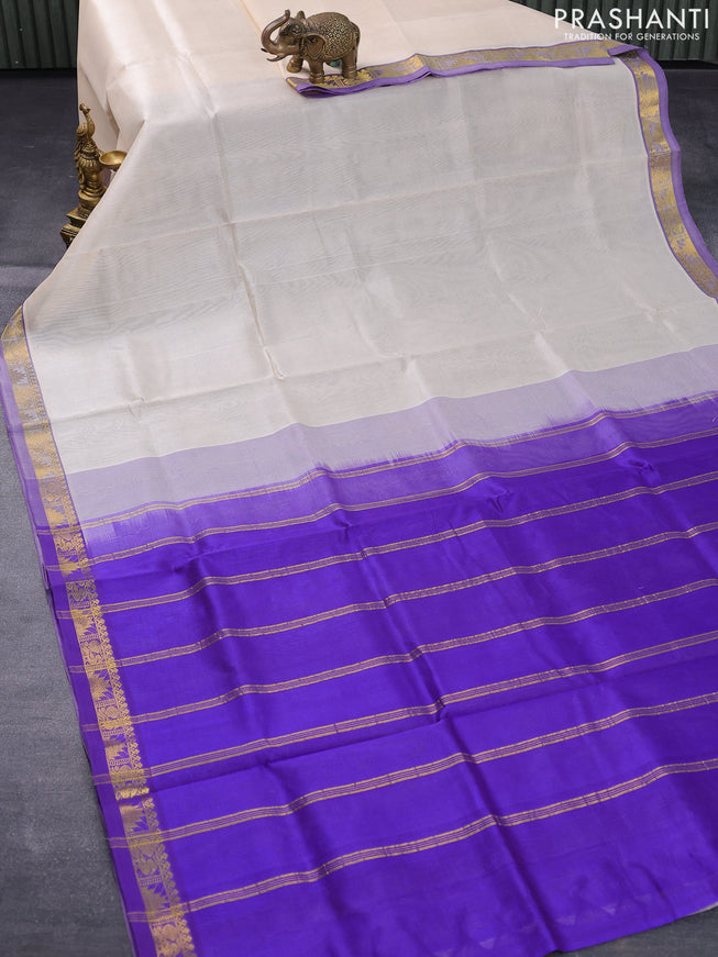 Silk cotton saree cream and blue with plain body and small zari woven border