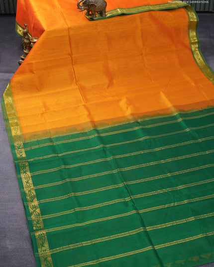 Silk cotton saree orange and green with plain body and small zari woven border