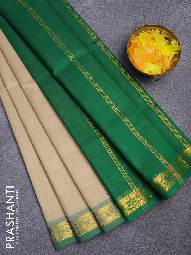 Silk cotton saree beige and green with plain body and small zari woven border