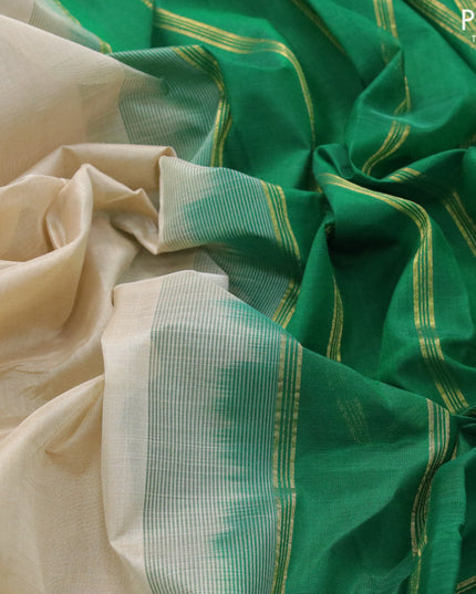 Silk cotton saree beige and green with plain body and small zari woven border