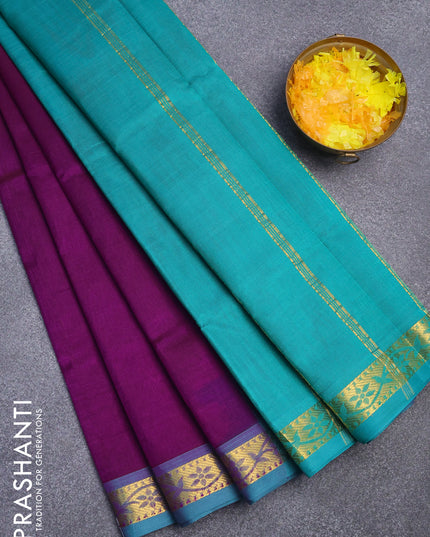 Silk cotton saree deep purple and green with plain body and small zari woven border
